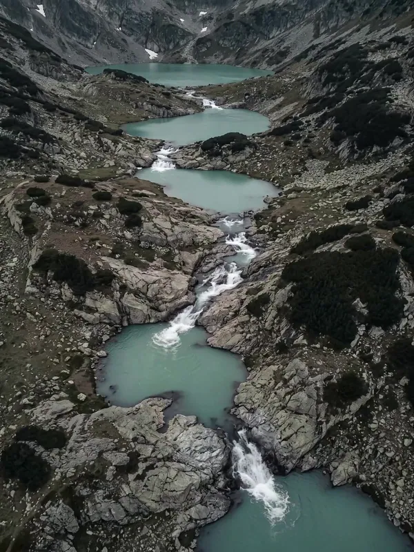 Aerial view of glacial lakes linked by a stream in the Rila mountains